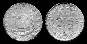 The first world currency—a Spanish silver real de a ocho or milled dollar.